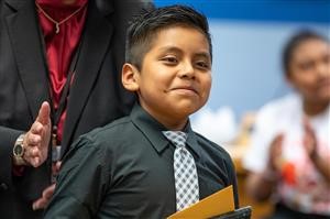  Josue smiling after receiving award